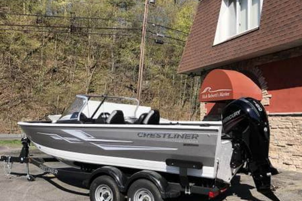 Silver and white boat on a trailer