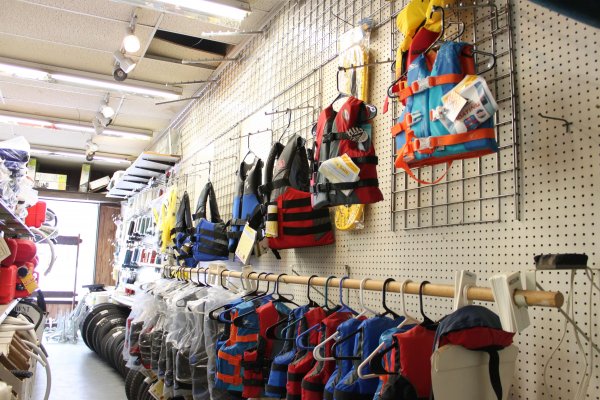 Selection of life jackets in store aisle