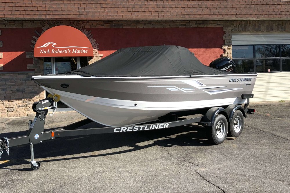 Boat on trailer with black boat cover