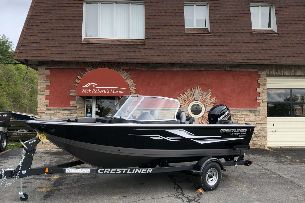 Black fishing boat on display