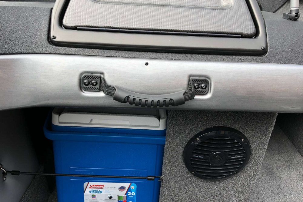 Blue cooler stored under boat dash